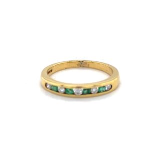 EMERALD AND DIAMOND HALF ETERNITY RING